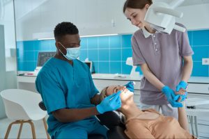 A dentist examining a patient.