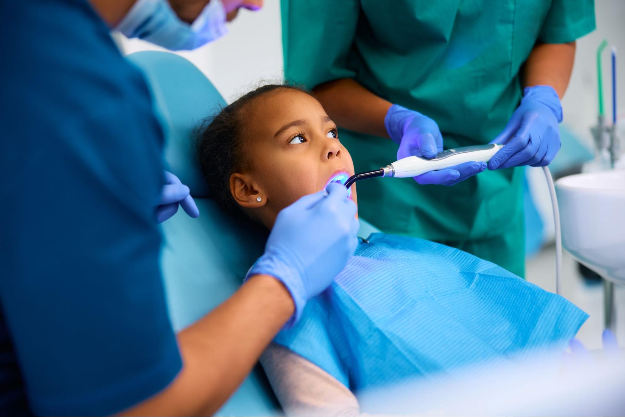 A calm toddler during a dental procedure.