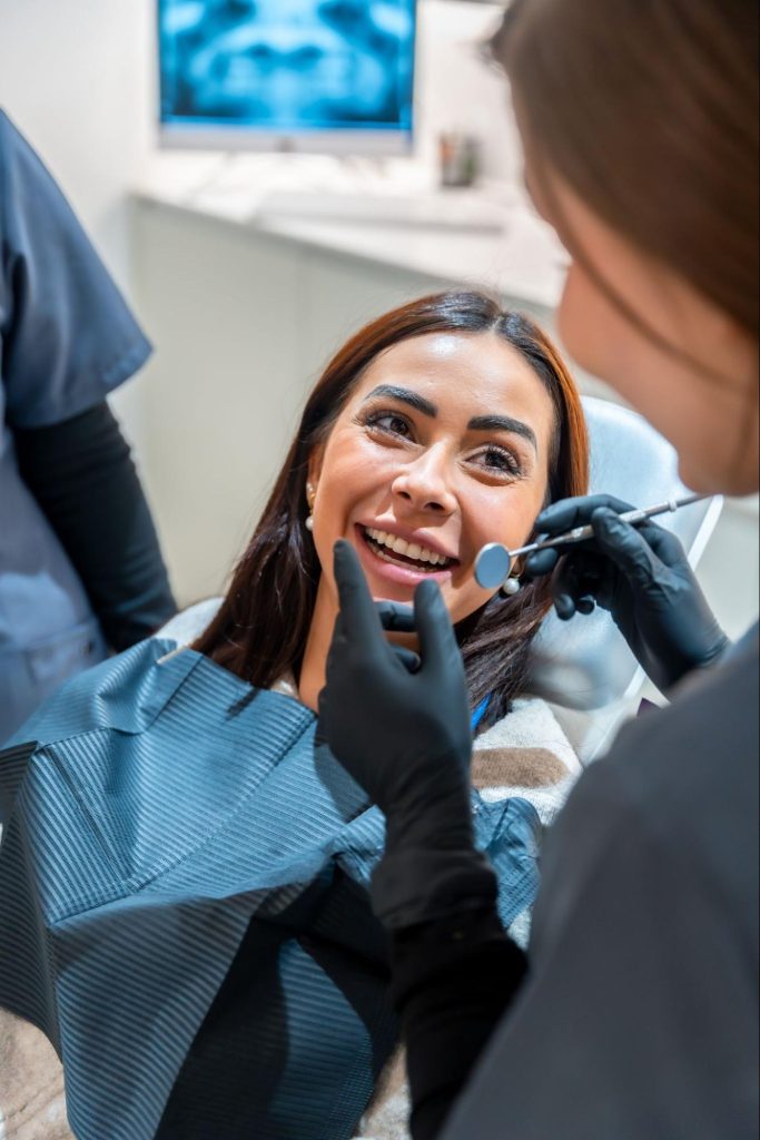 A female patient looks thrilled about the results of her upcoming cosmetic procedure.